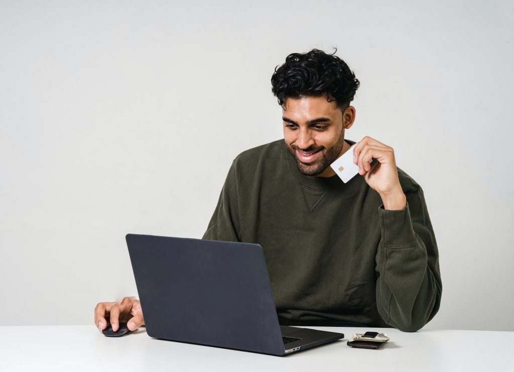 photo of man using a laptop